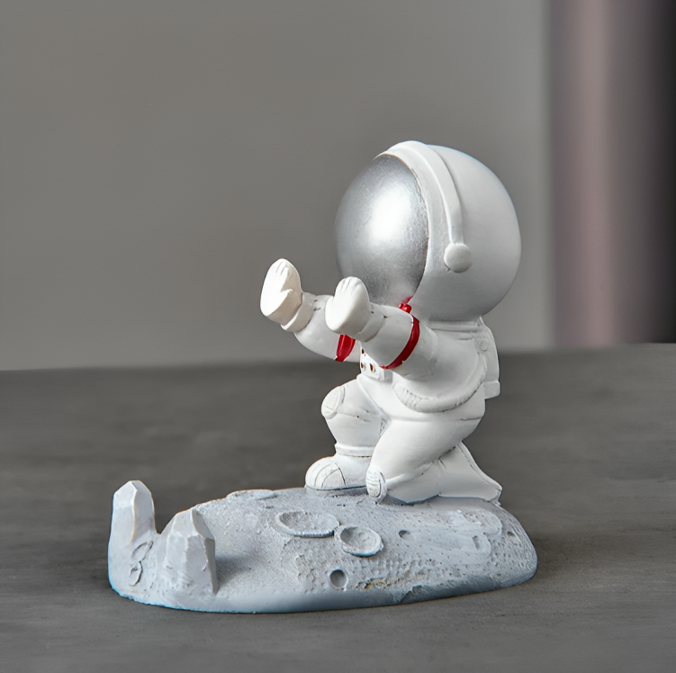 O Brinquedo® - Astroholder™ Suporte Para Celular Com Design De Astronauta Sentado Prata